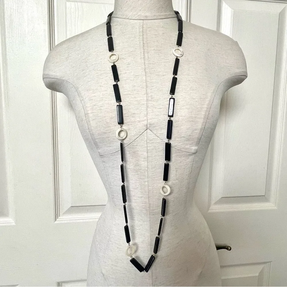 Long black beaded necklace with cream circle beads